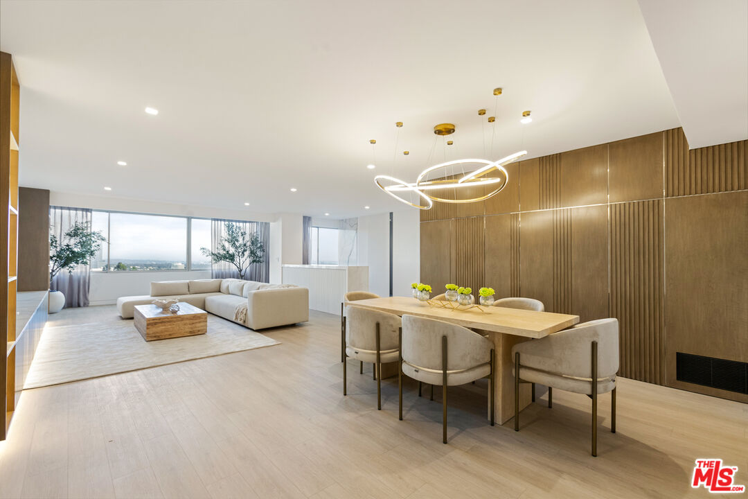 a view of a dining area with furniture and wooden floor