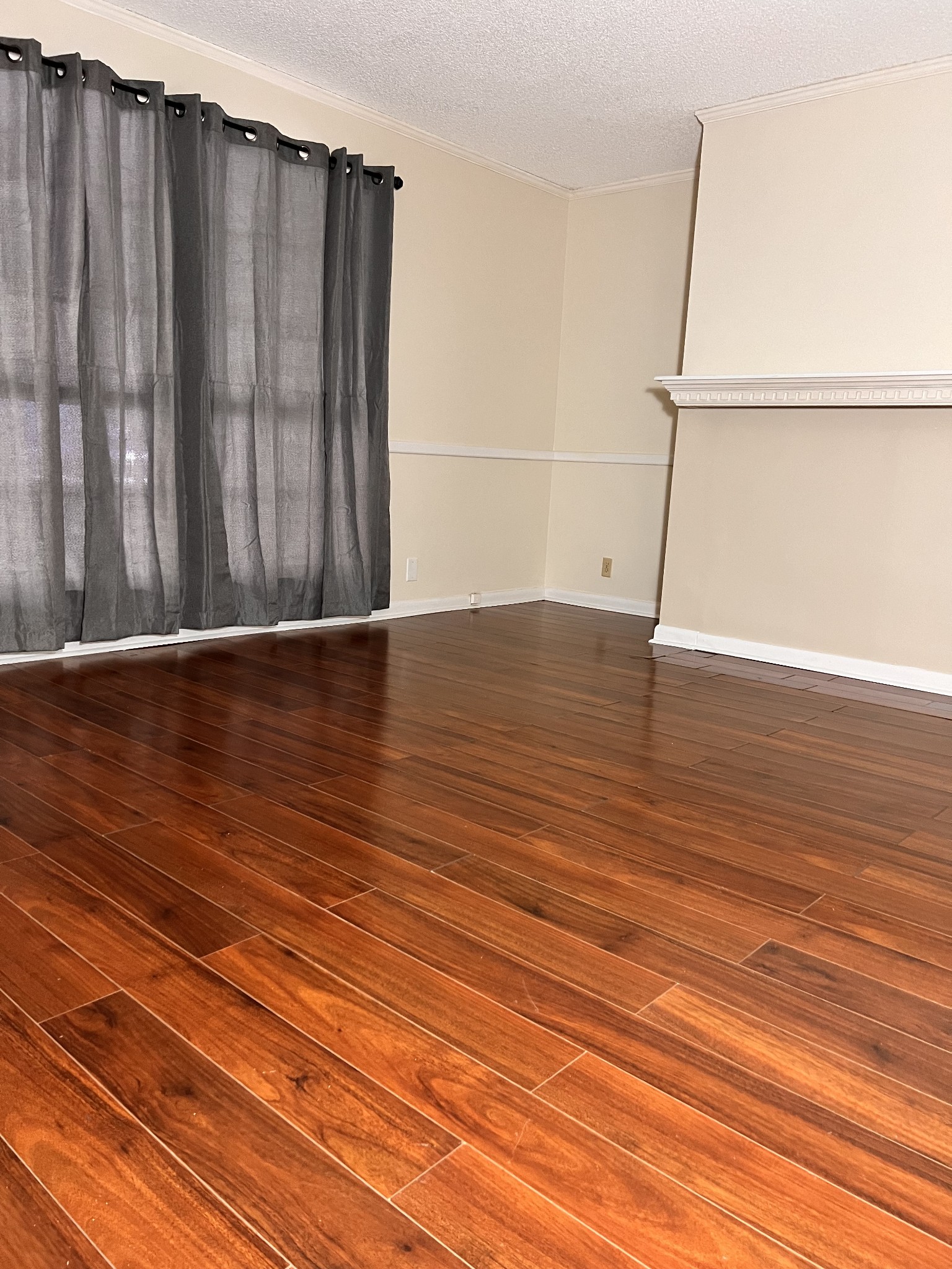 a view of wooden floor with staircase