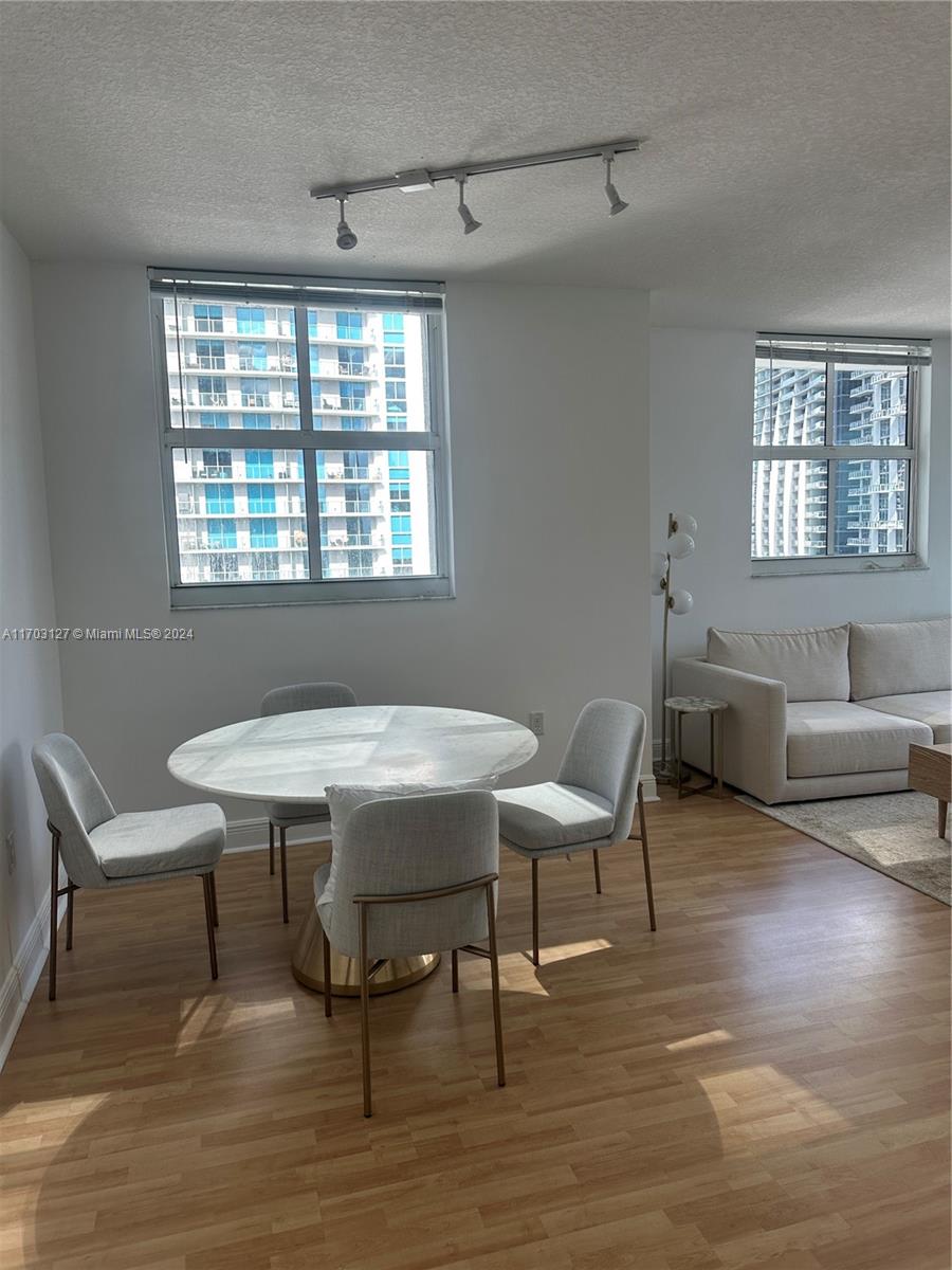 a work room with furniture and windows