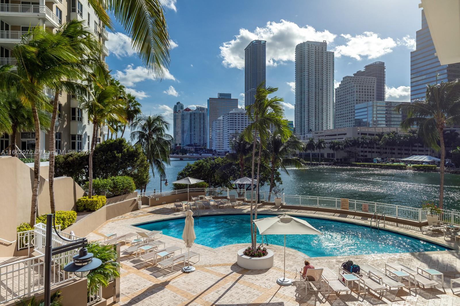 a swimming pool with outdoor seating and yard