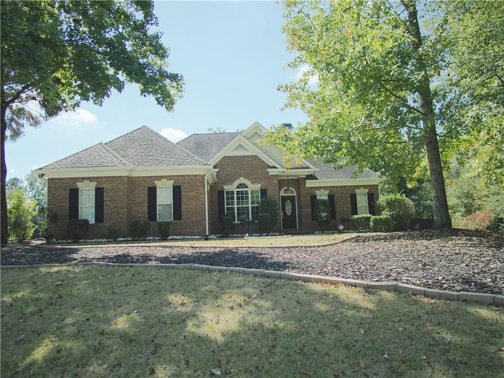 a front view of a house with a yard