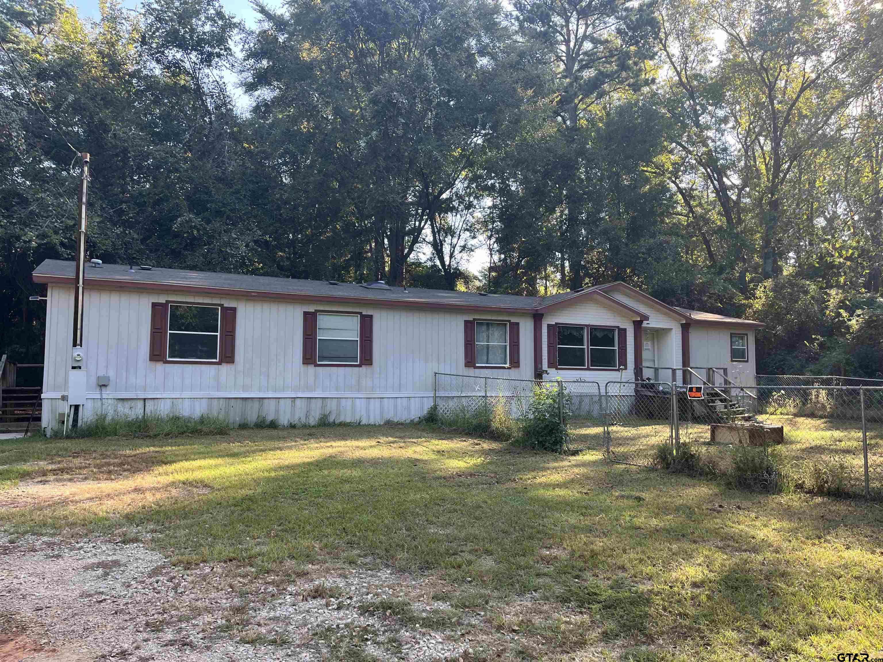 a view of a yard in front of a house