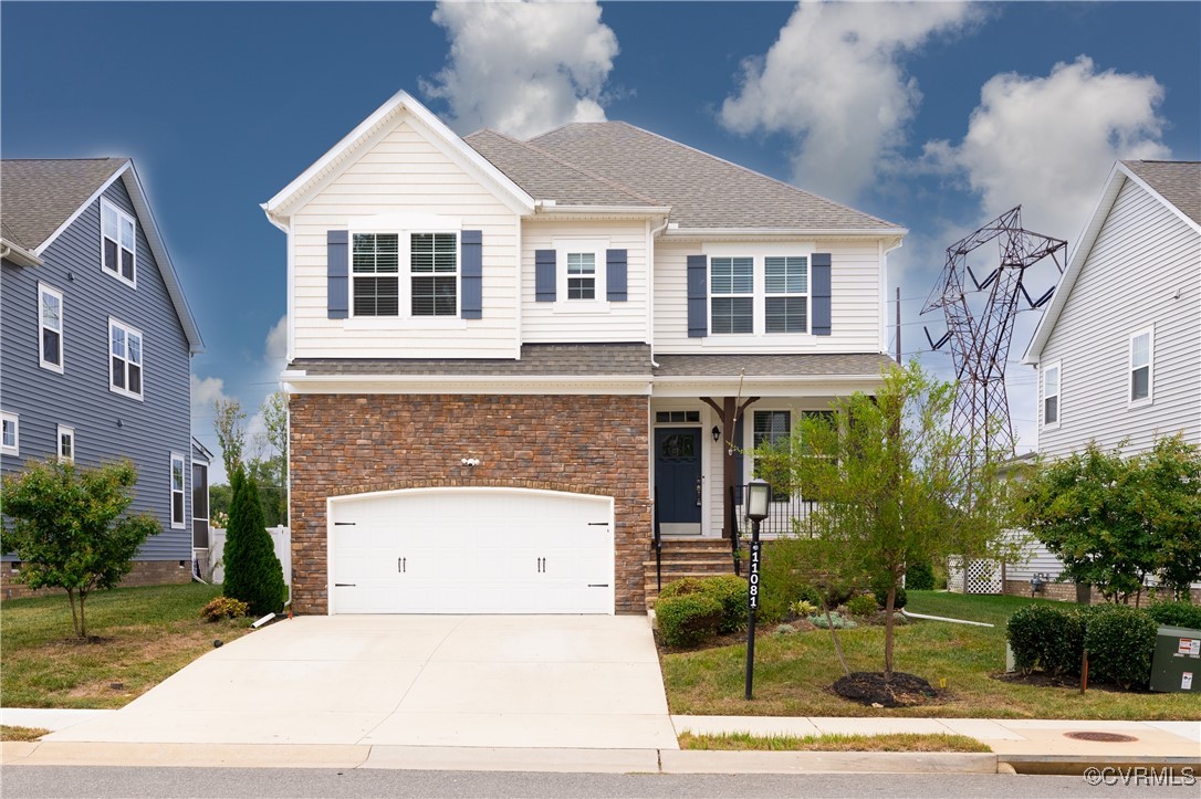 View of front of home featuring a garage, a front