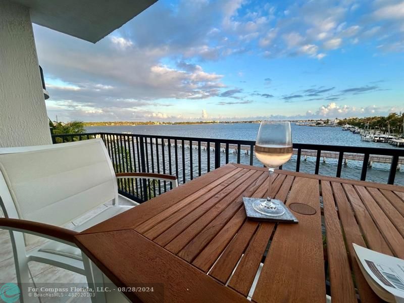 a view of a roof deck with wooden floor and fence