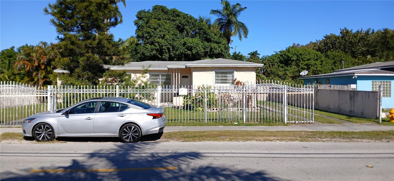 a view of a car parked in front of a house