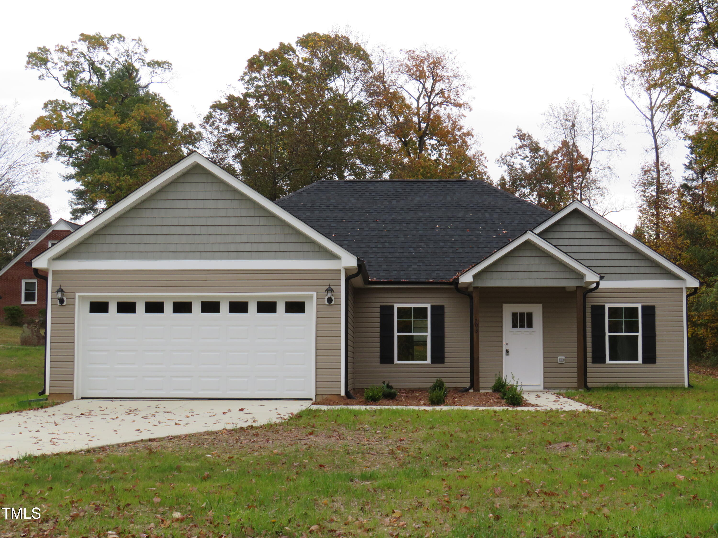 front view of a house with a yard