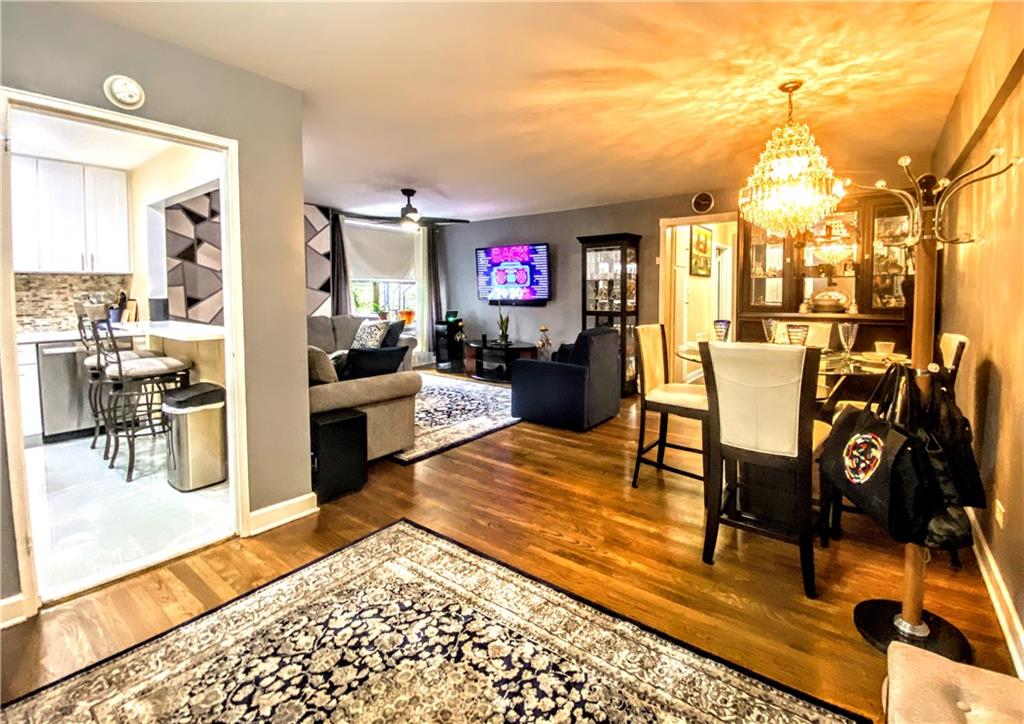 a living room with furniture and a rug