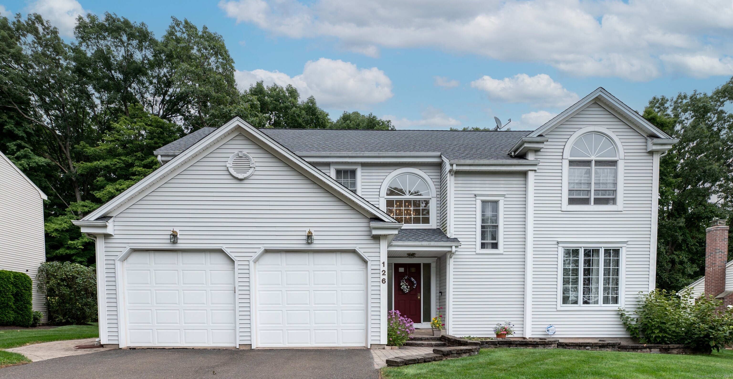 a view of house with yard