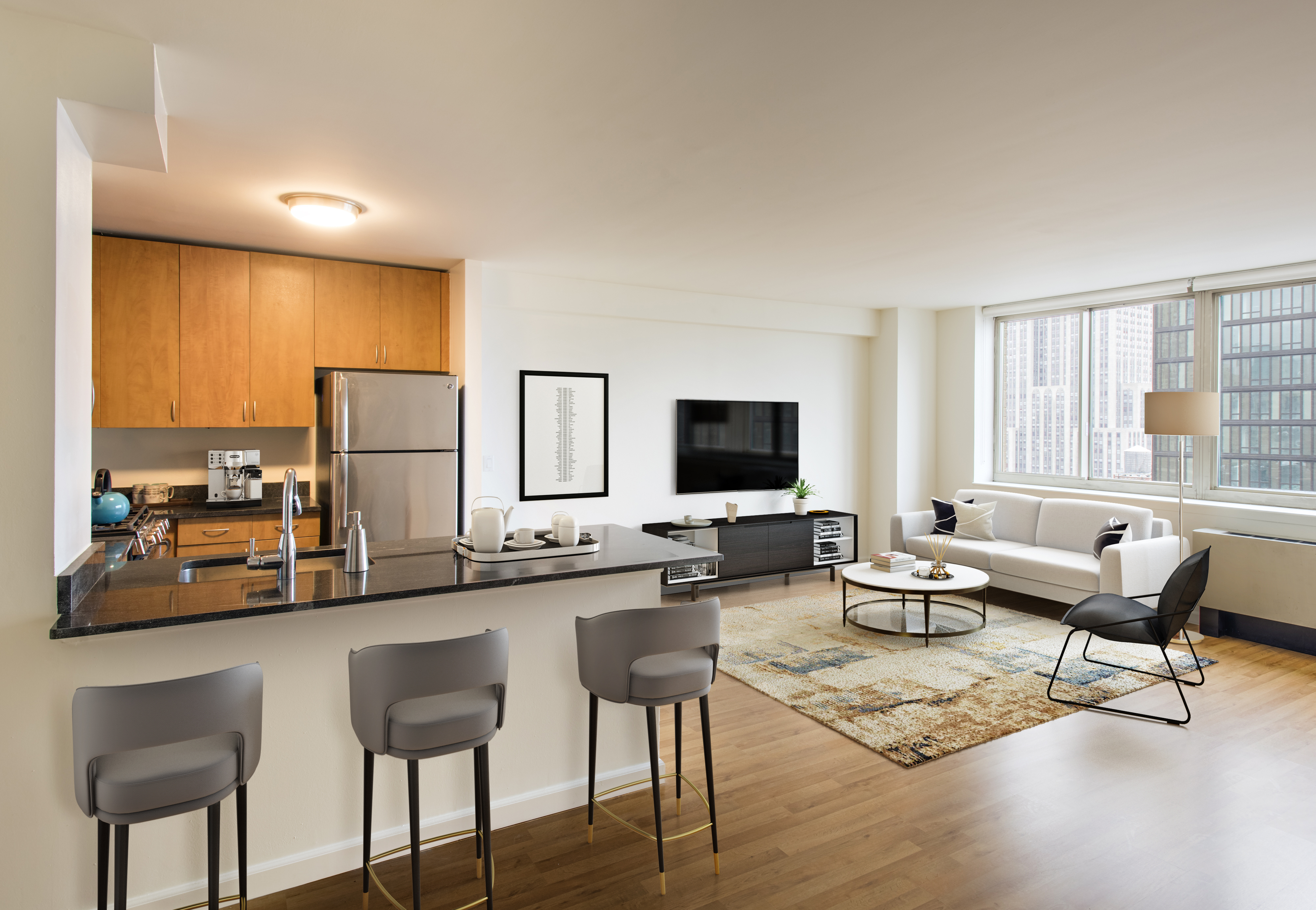 a living room with furniture and a flat screen tv