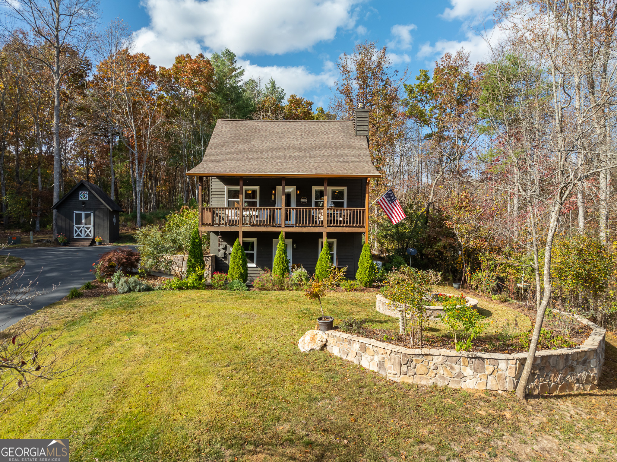 a view of a house with backyard porch and sitting area