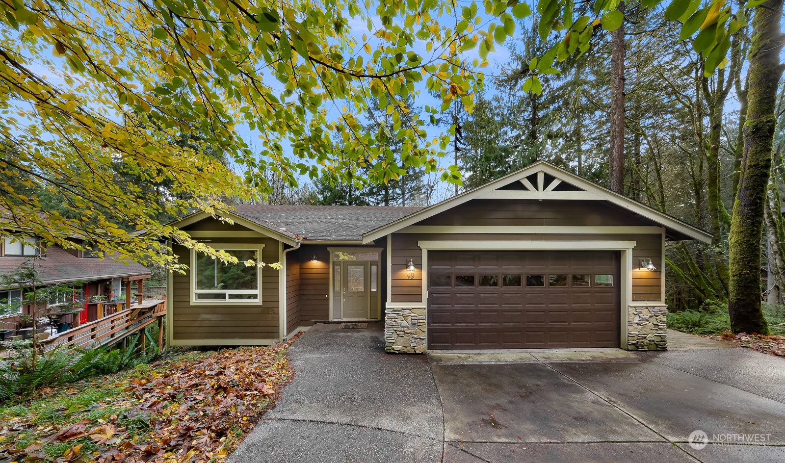 a front view of a house with a garage