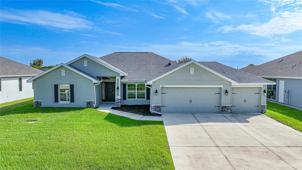 front view of a house with a yard