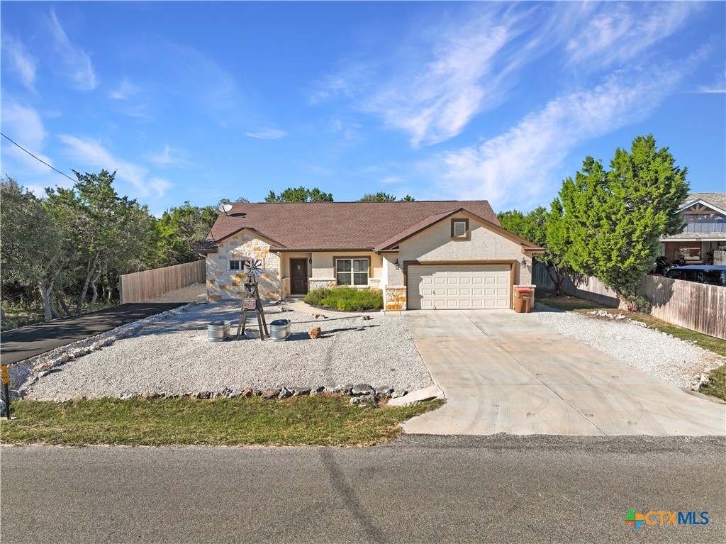 a view of house with outdoor space and garden