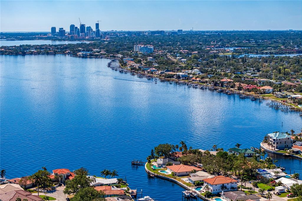 an aerial view of a house with a lake view