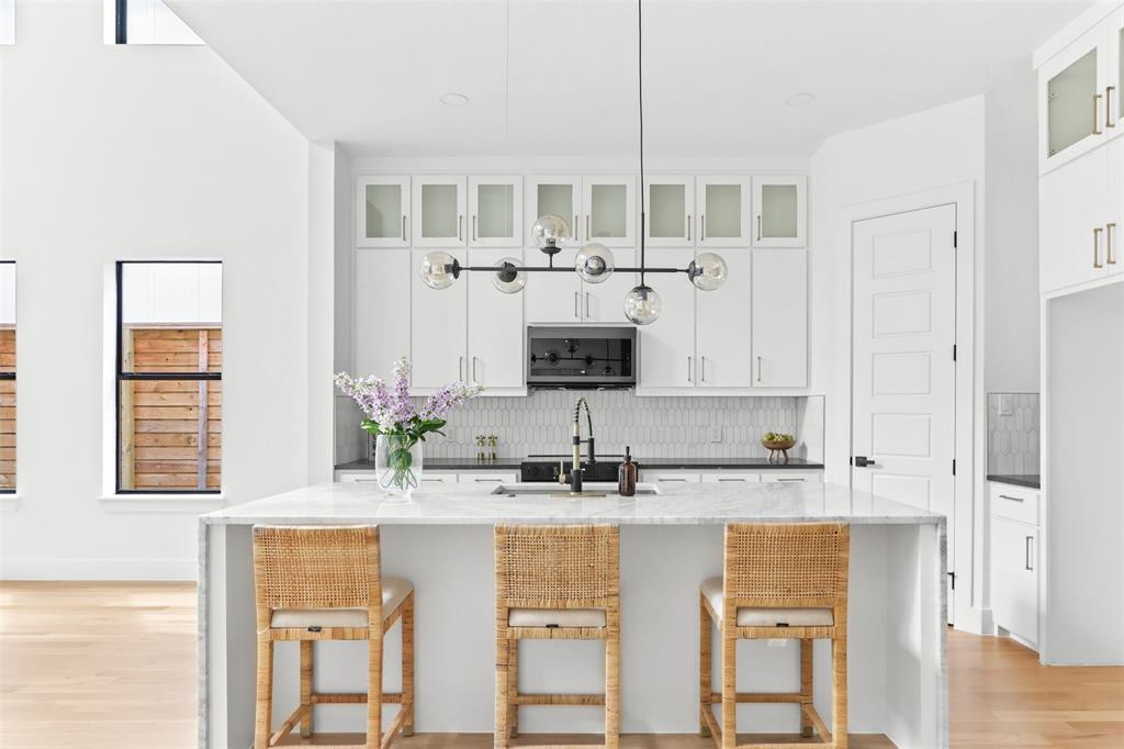 a kitchen with stainless steel appliances granite countertop a sink and cabinets