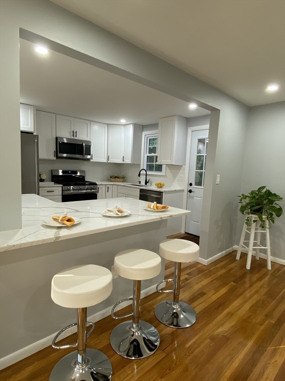 a kitchen with a table and chairs