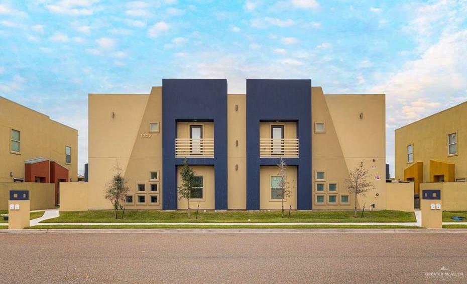 a view of a big building next to a road