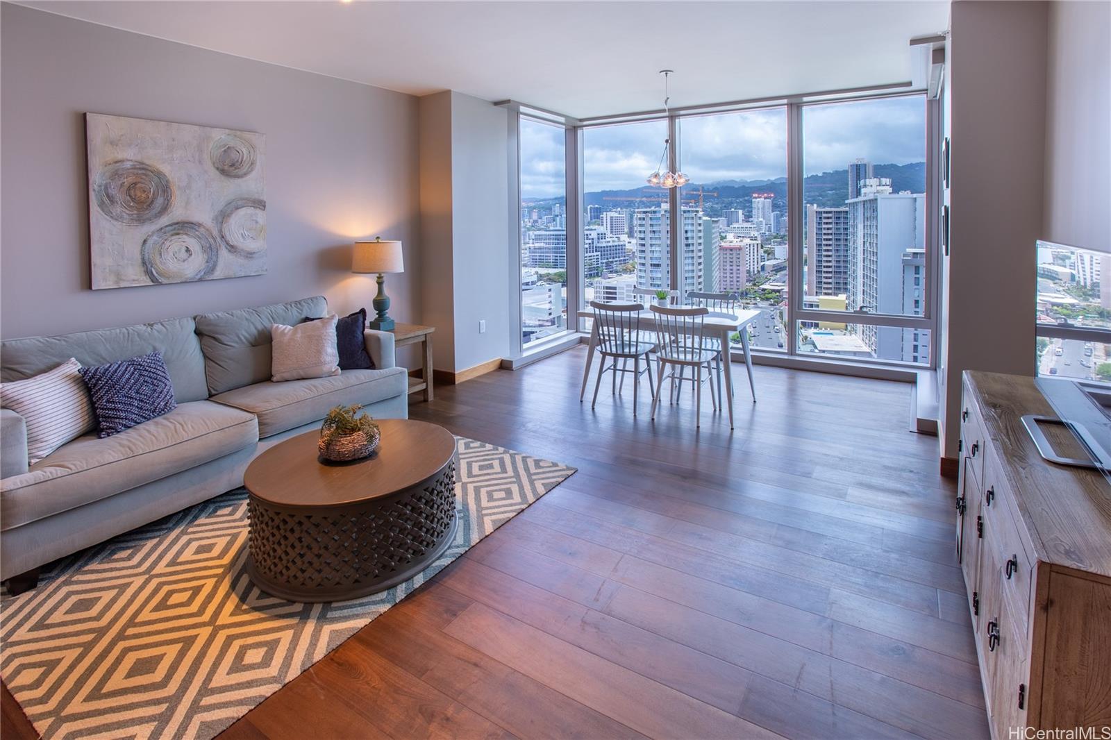 a living room with furniture and a large window