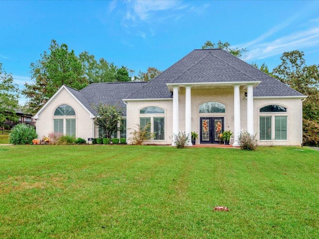 a front view of a house with a yard