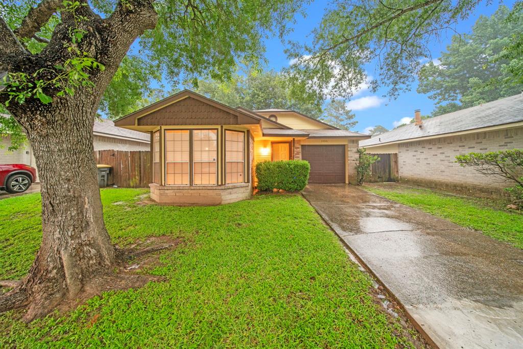 a view of a front of a house with a yard