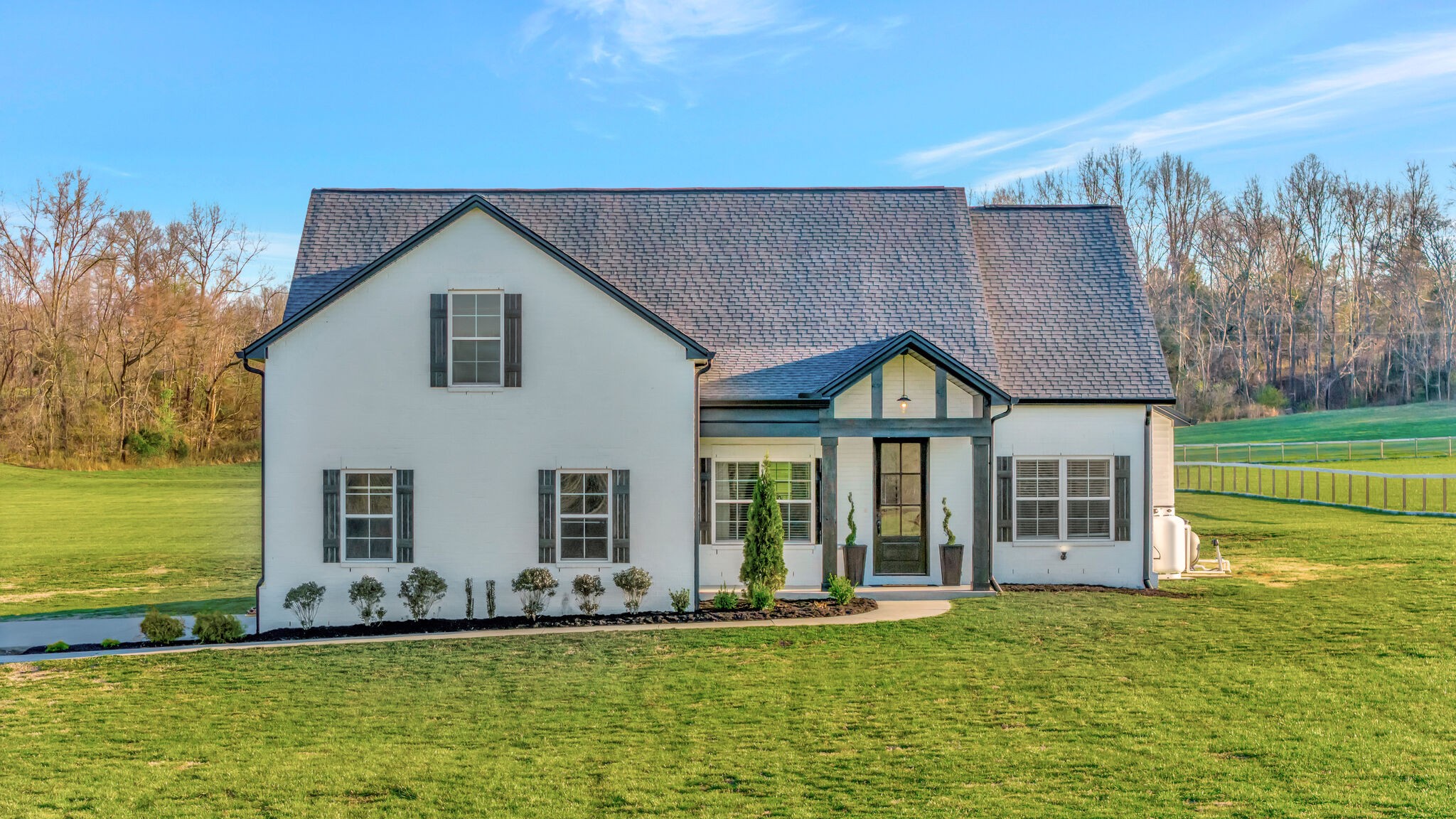 a front view of a house with garden