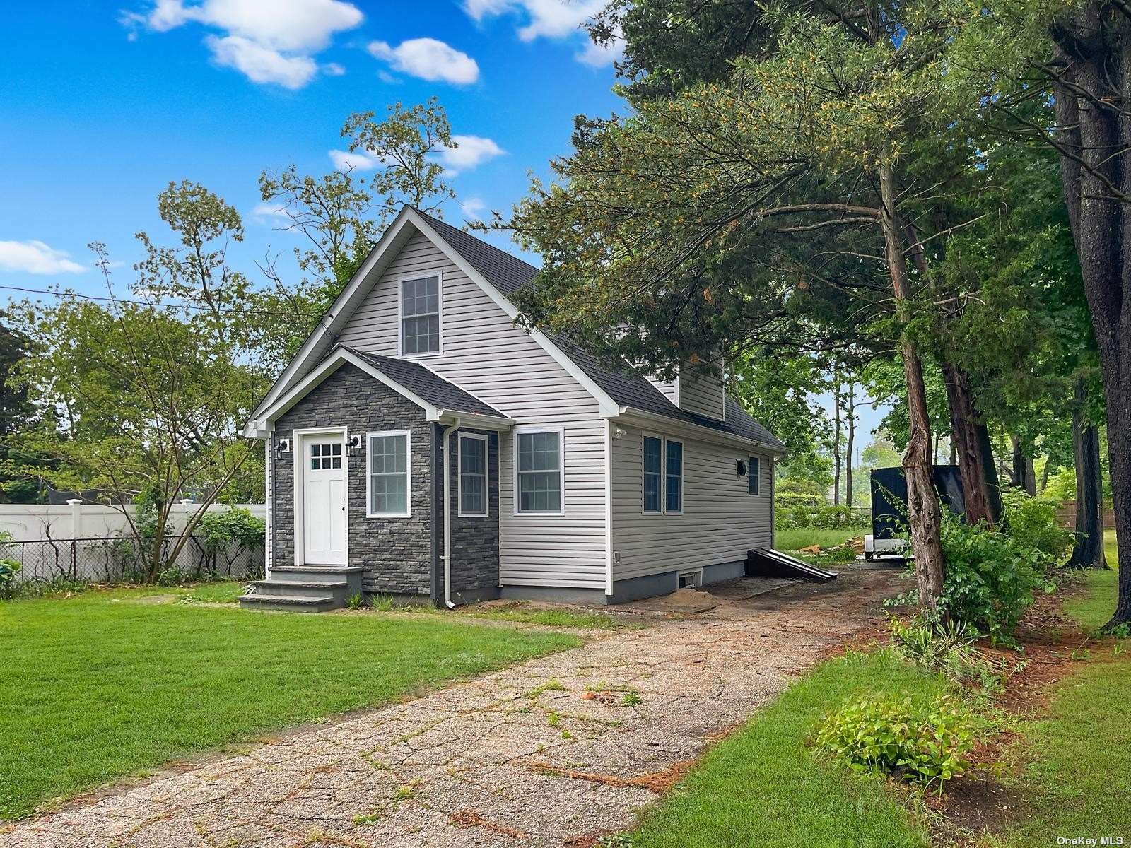 front view of a house with a yard