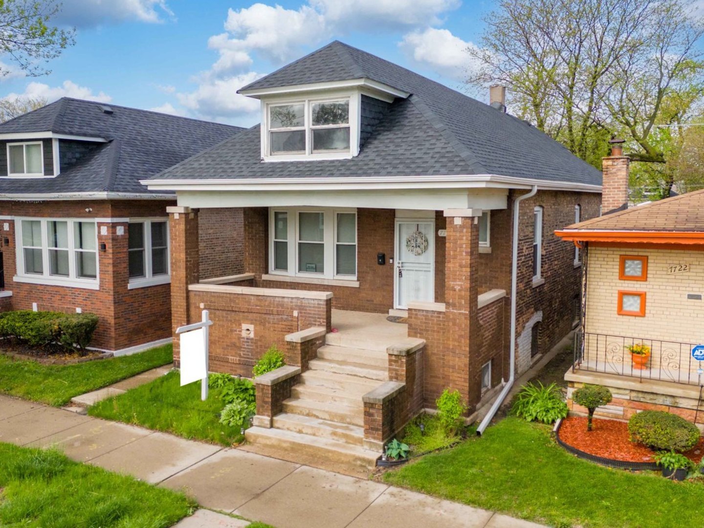 a front view of a house with a yard