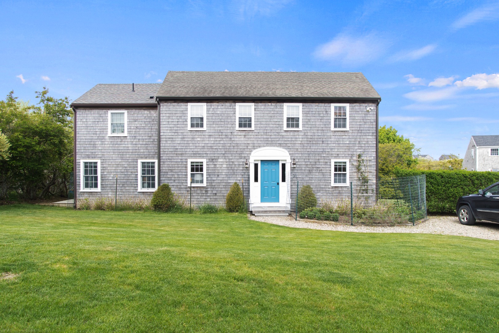 a front view of a house with a yard