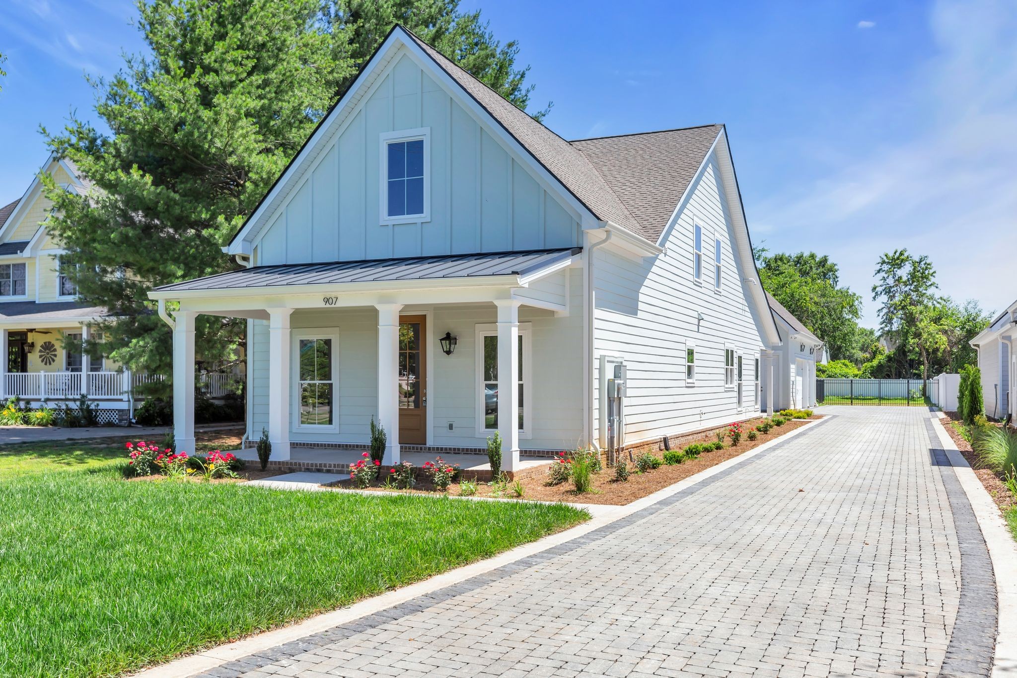 a view of a house with a yard and plants