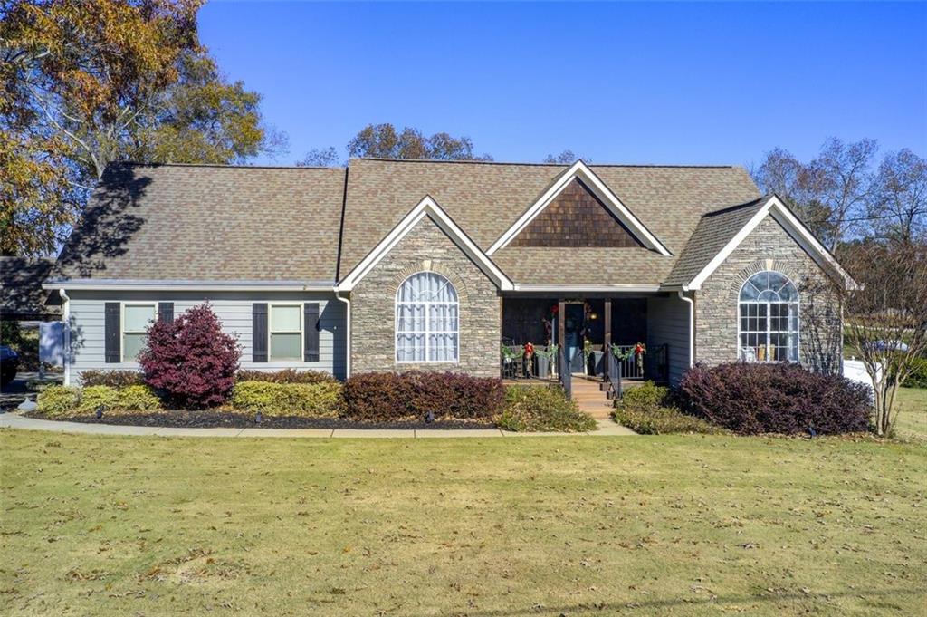 a front view of a house with a yard