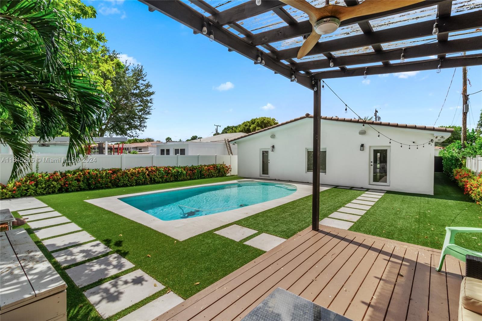 a view of a backyard with sitting area