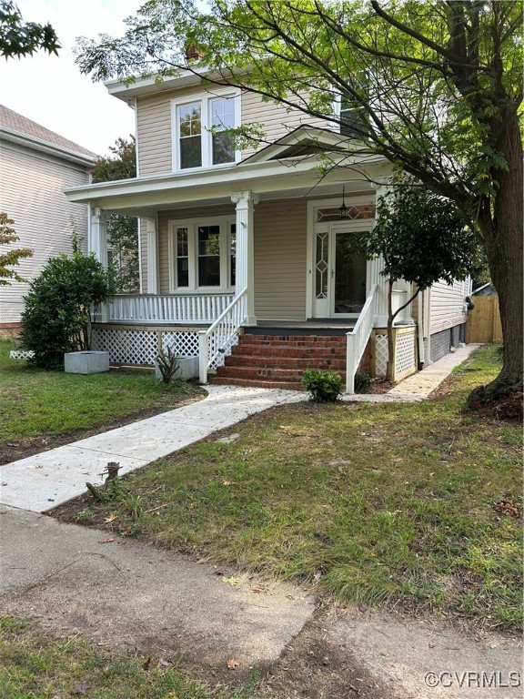 a view of a house with a yard and plants