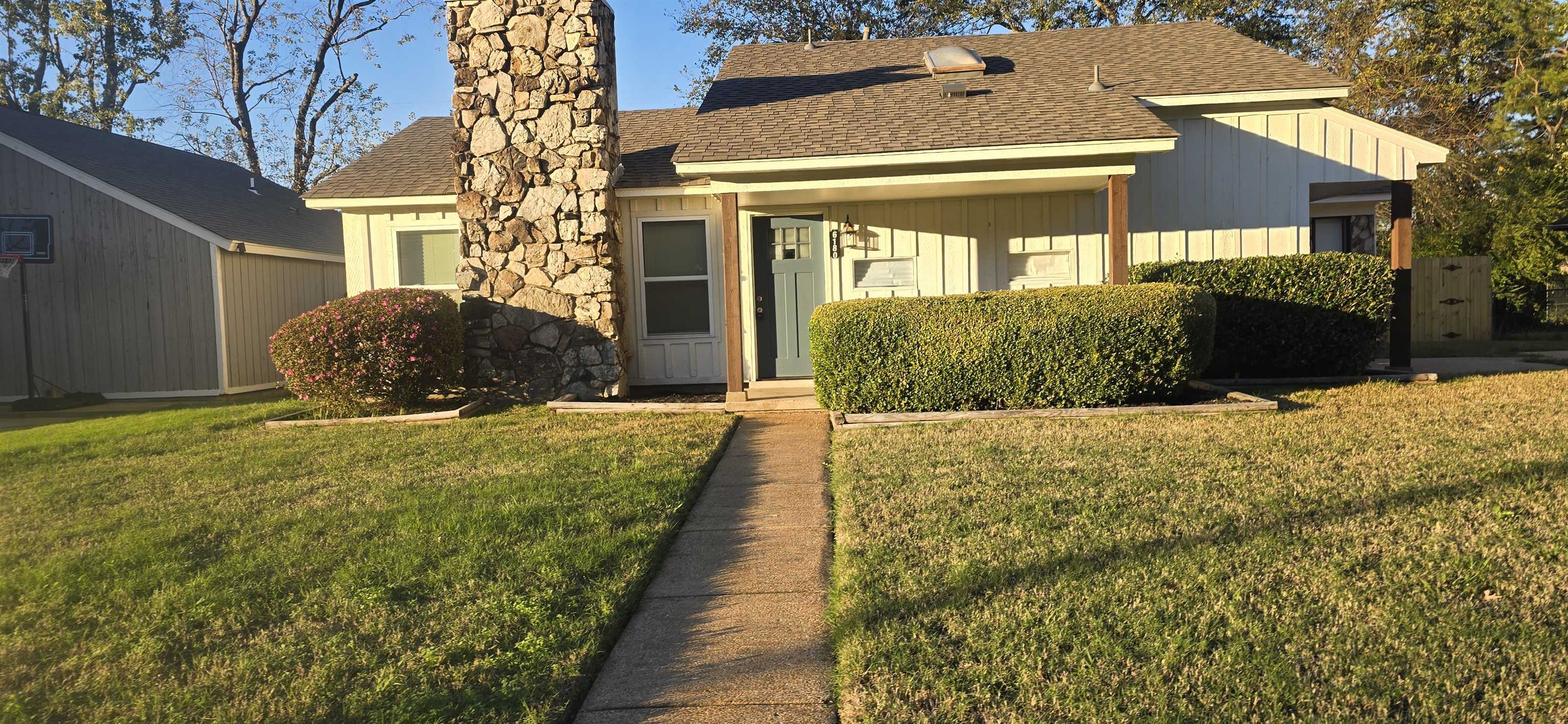 View of front of property with a front yard