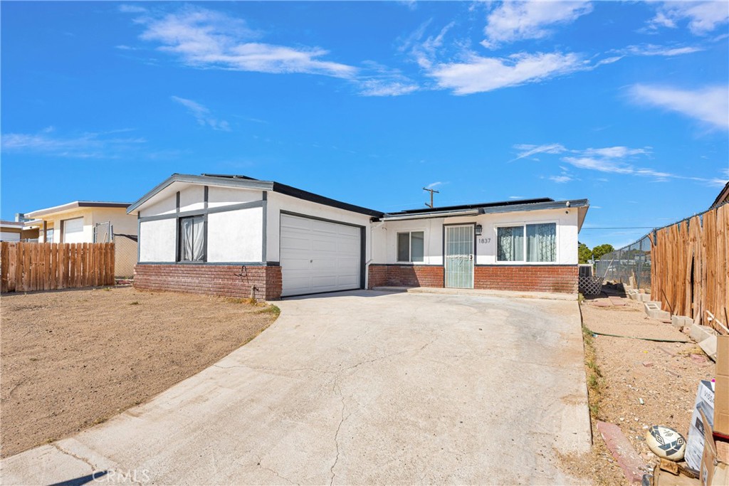 a front view of a house with a garage