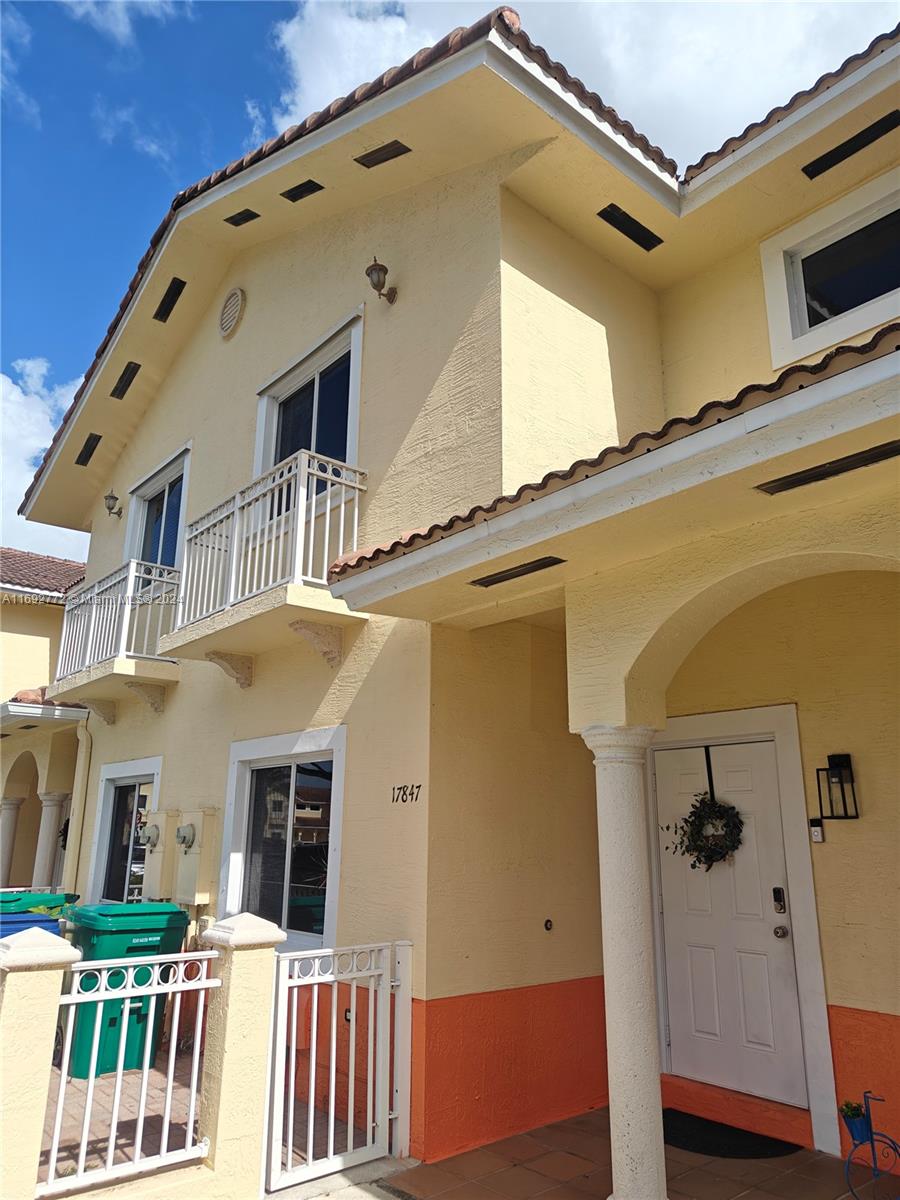 a front view of a house with a garage