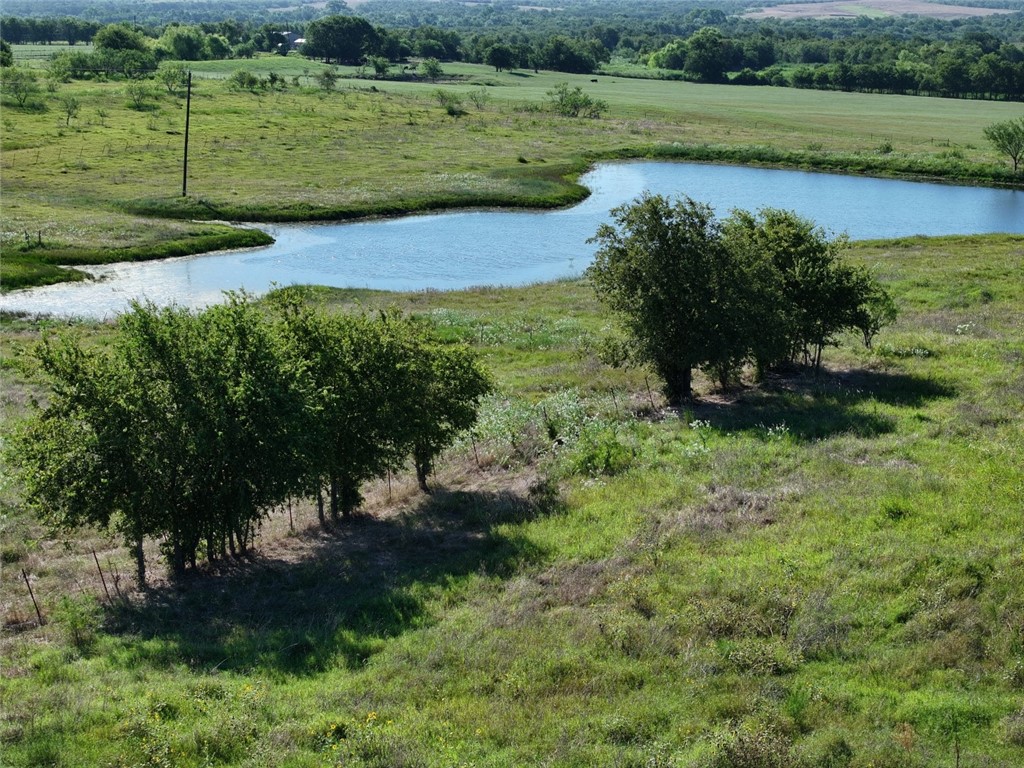 a view of a lake with a house in the background