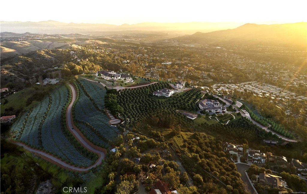 an aerial view of residential house with green space