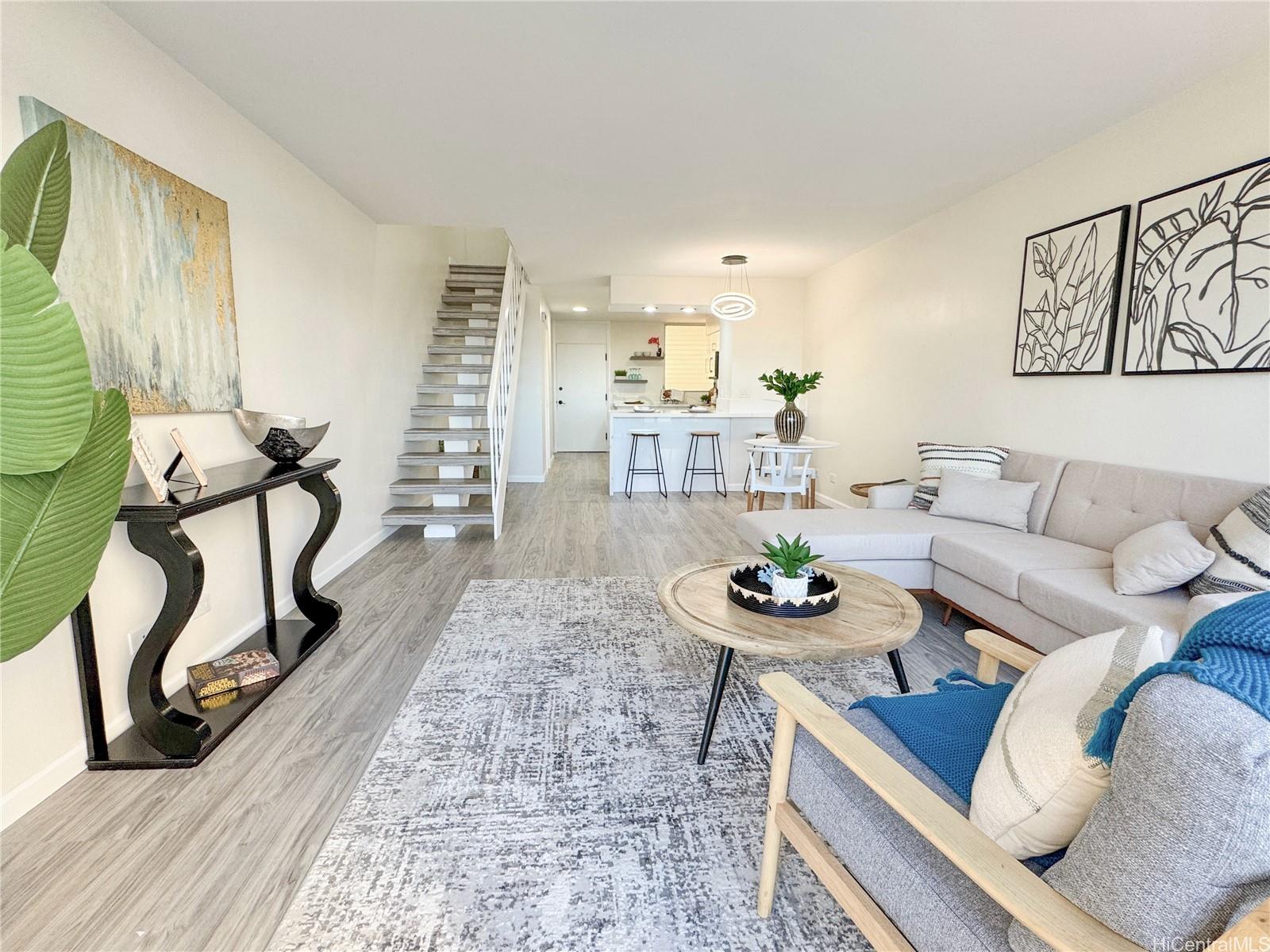 a living room with furniture and a rug