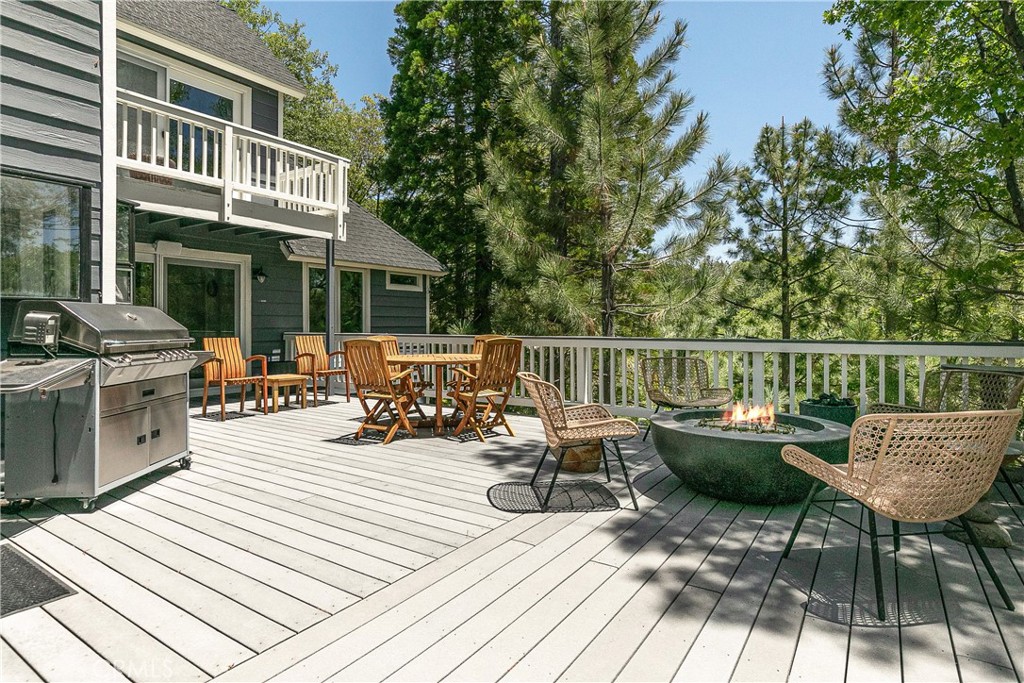 a view of a deck with chairs and couches