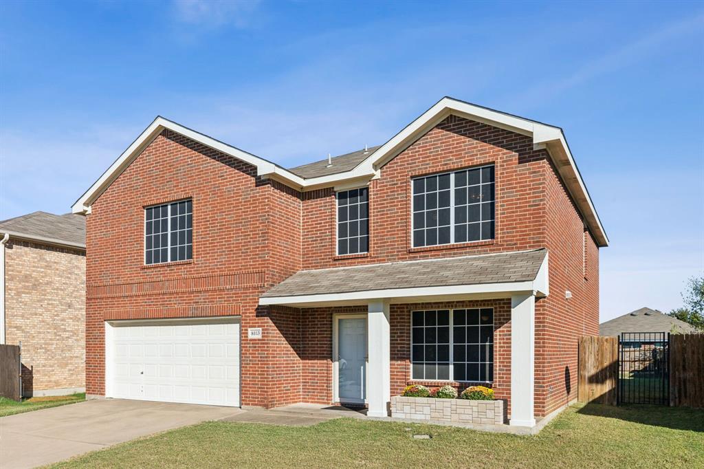 a front view of a house with garage