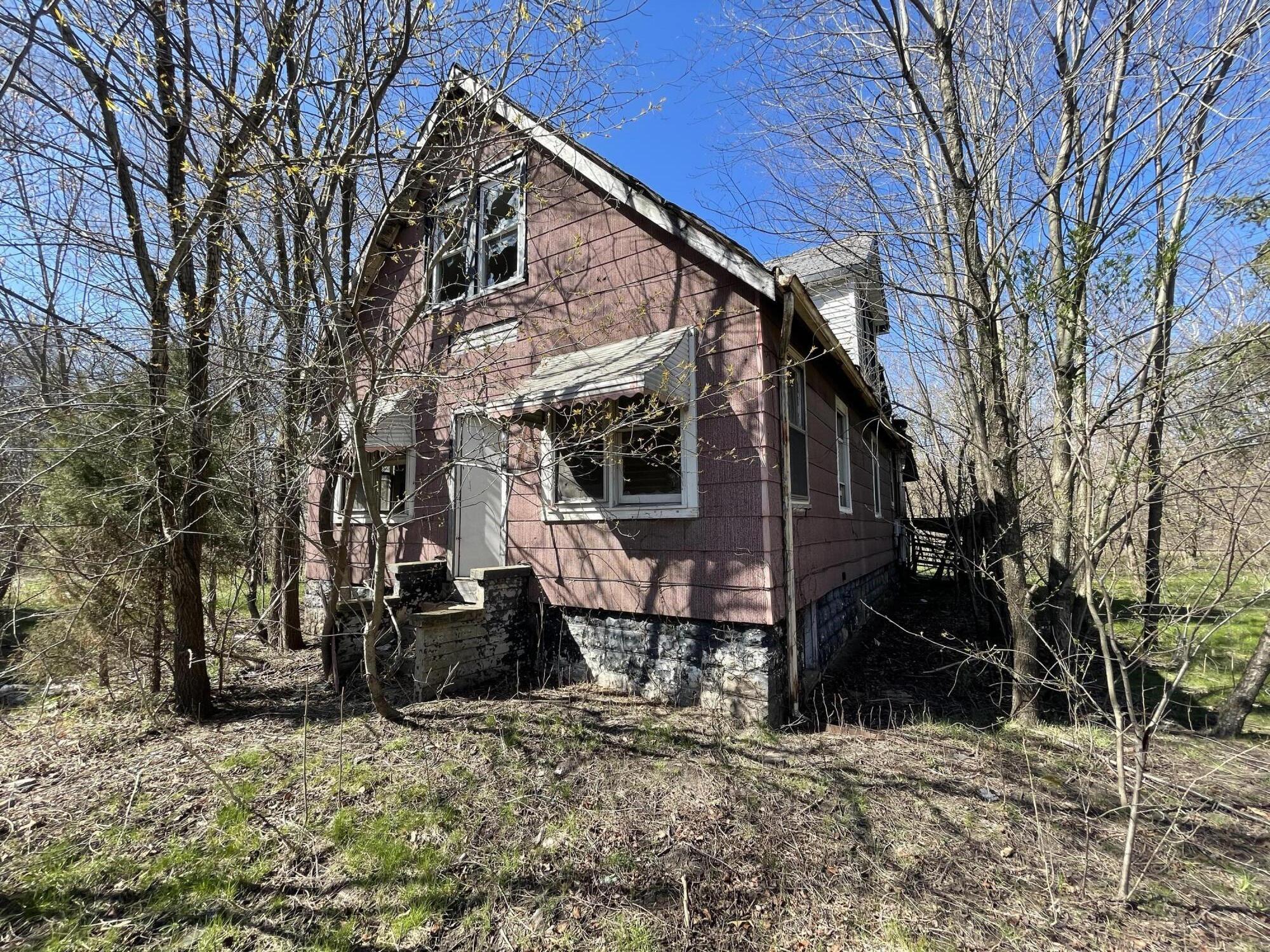 a front view of a house with yard