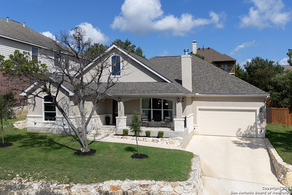 a front view of a house with garden