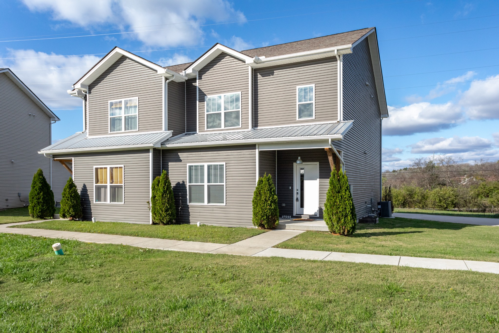 a front view of a house with a yard