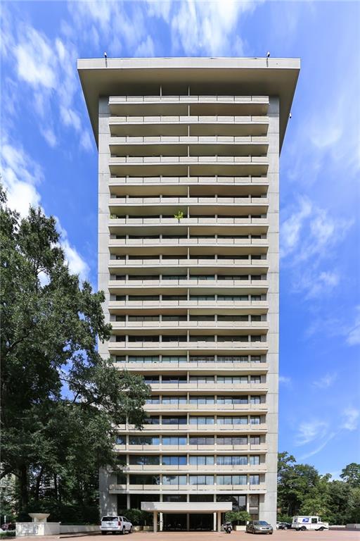 a view of a building with a plant in front of it