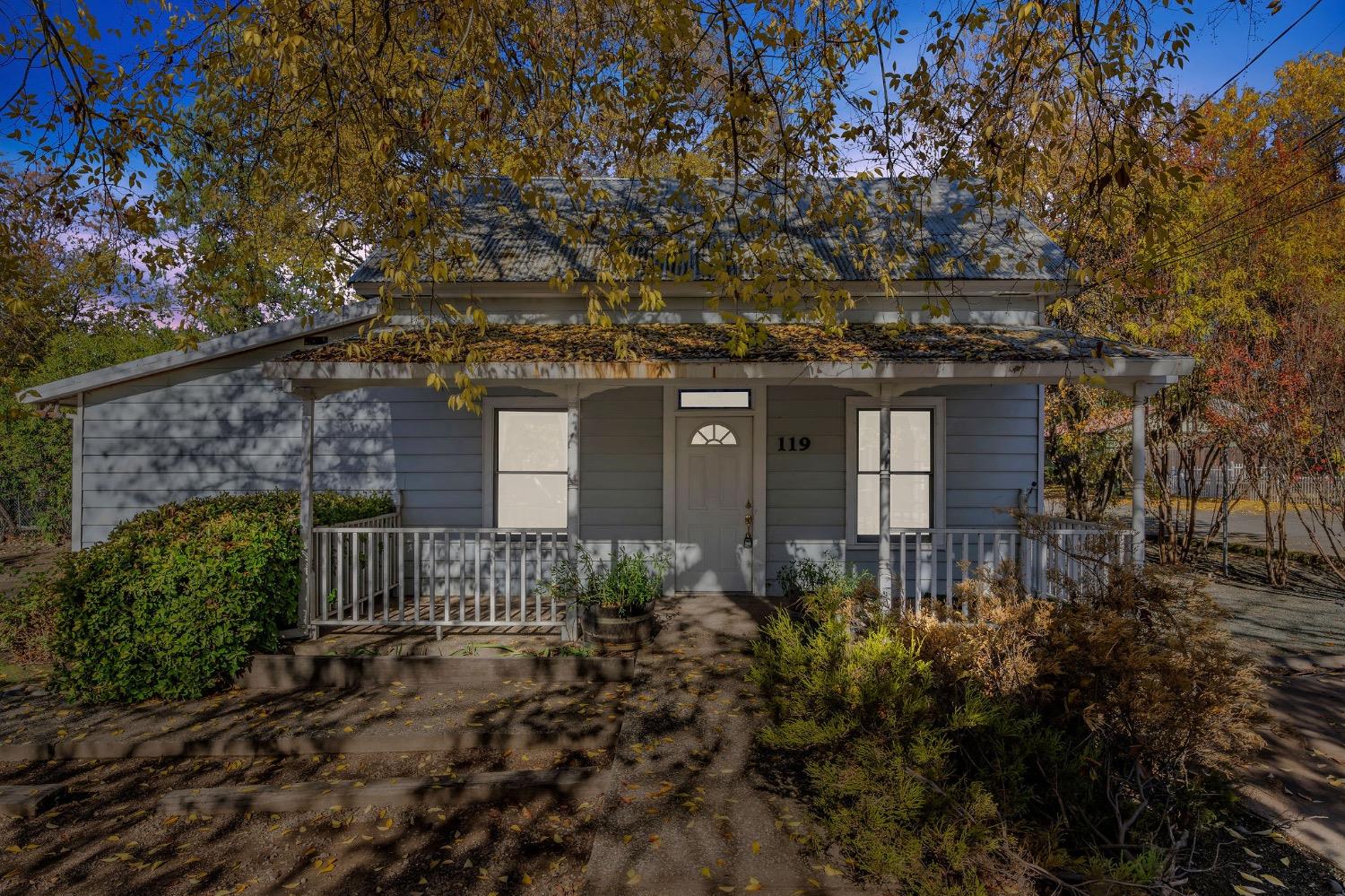 a front view of a house with garden