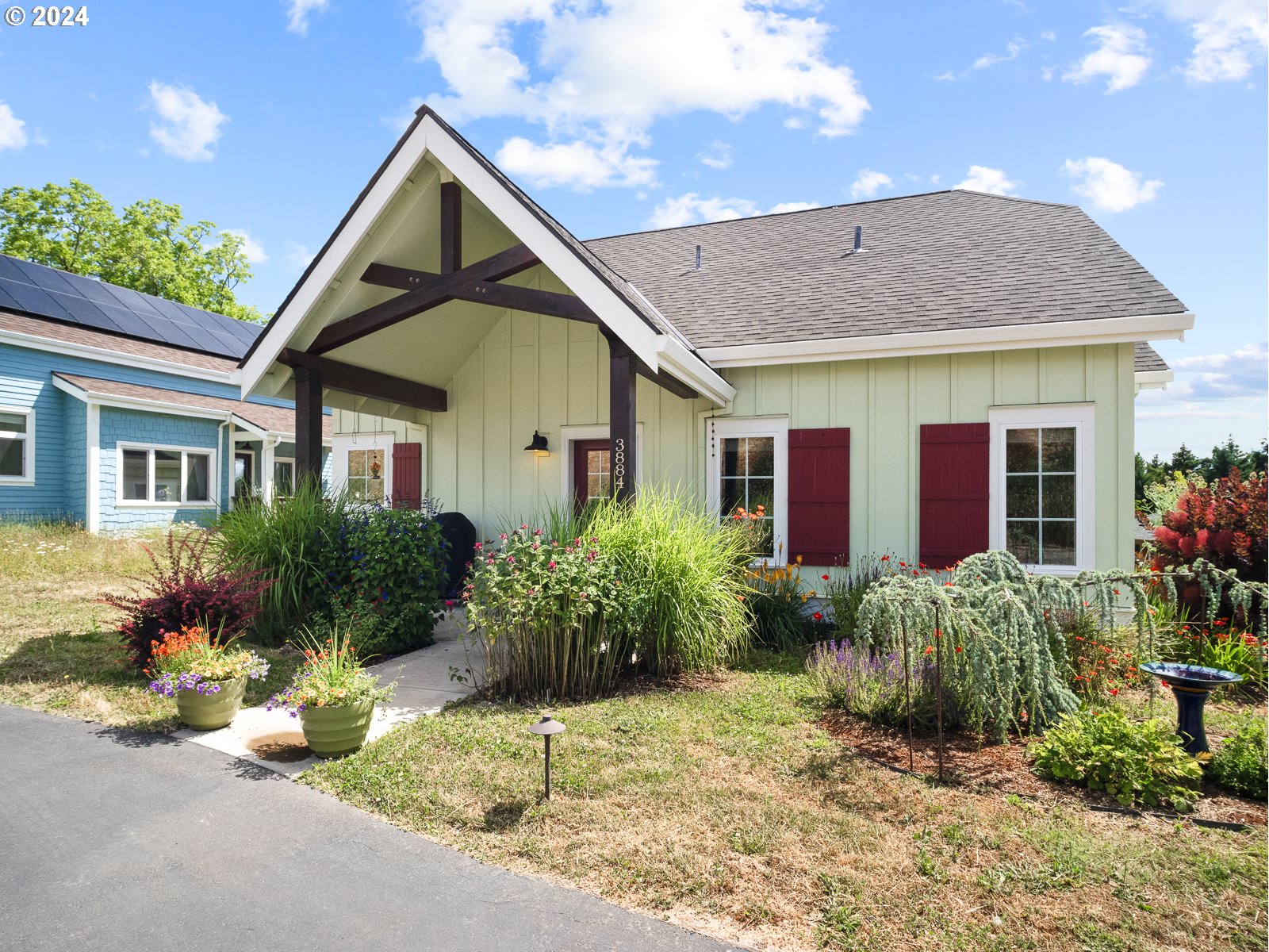 a front view of house with yard and green space