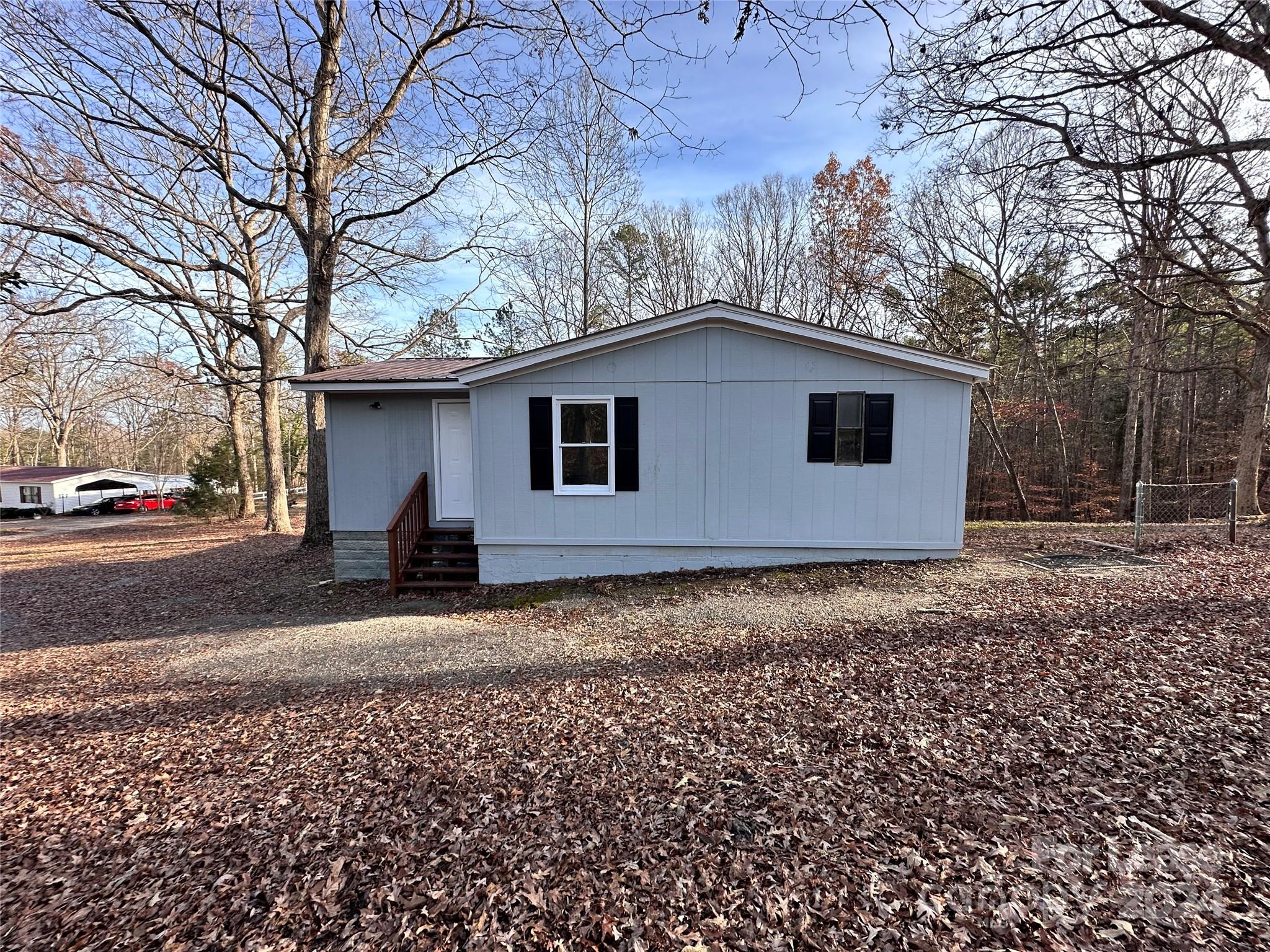 a house with trees in the background