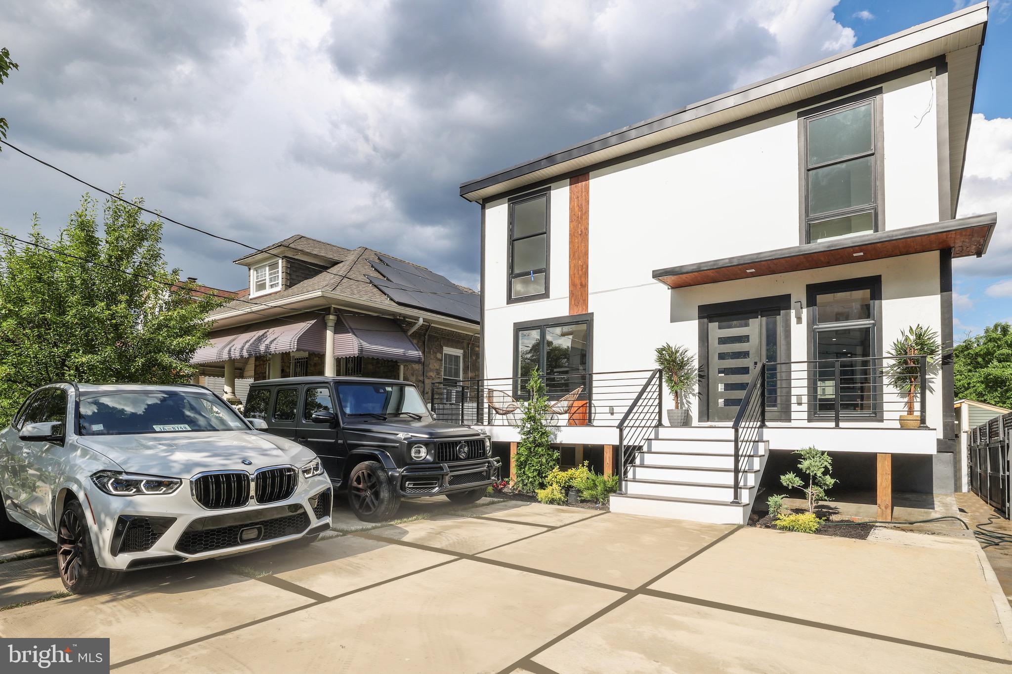 a front view of a house with parking space