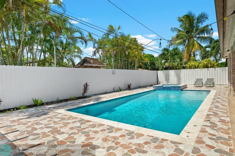 a view of swimming pool with a yard