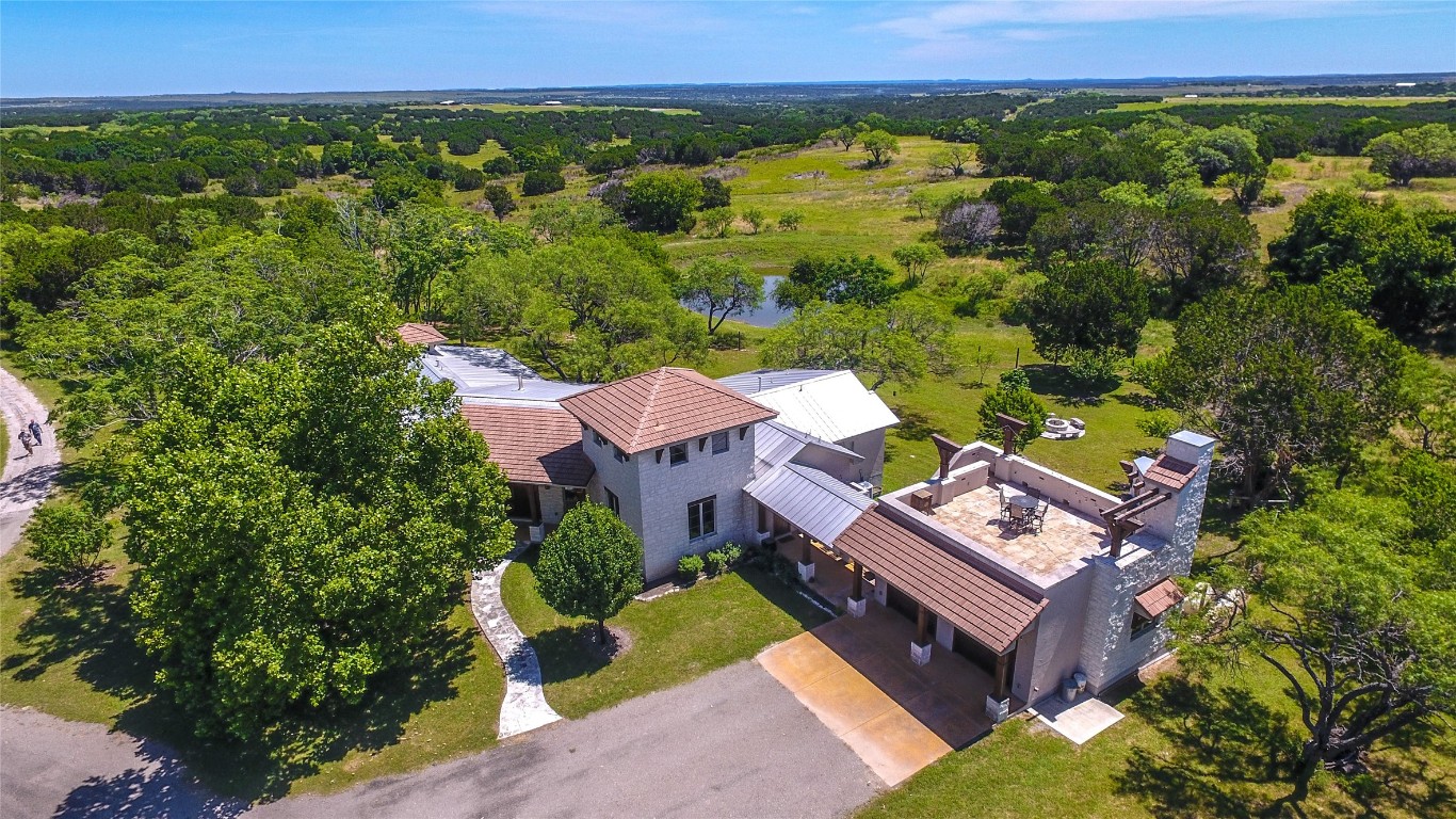 an aerial view of a house with a garden